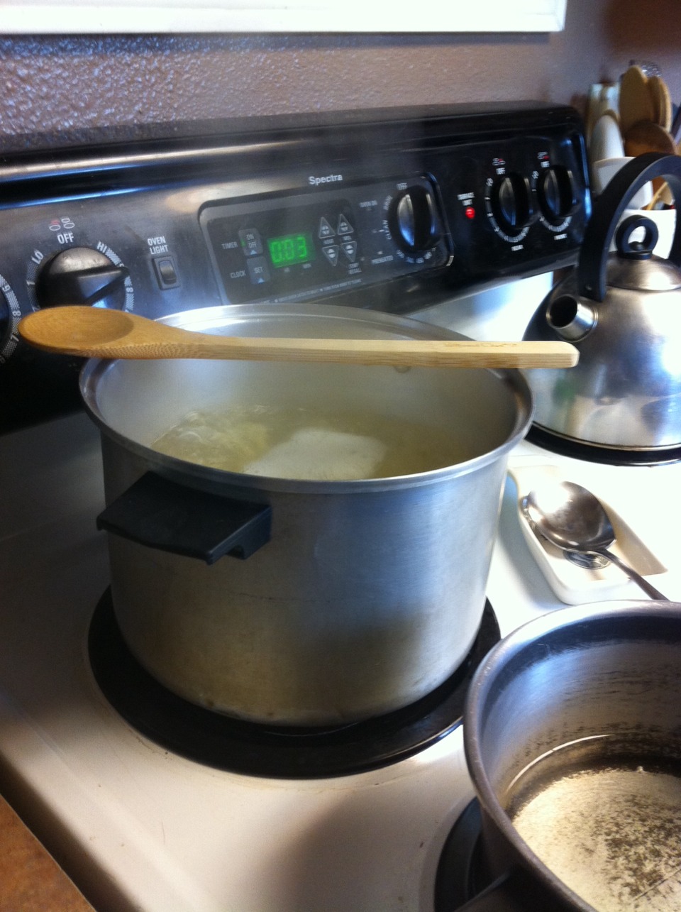 Put a wooden spoon over your pot to keep it from boiling over.